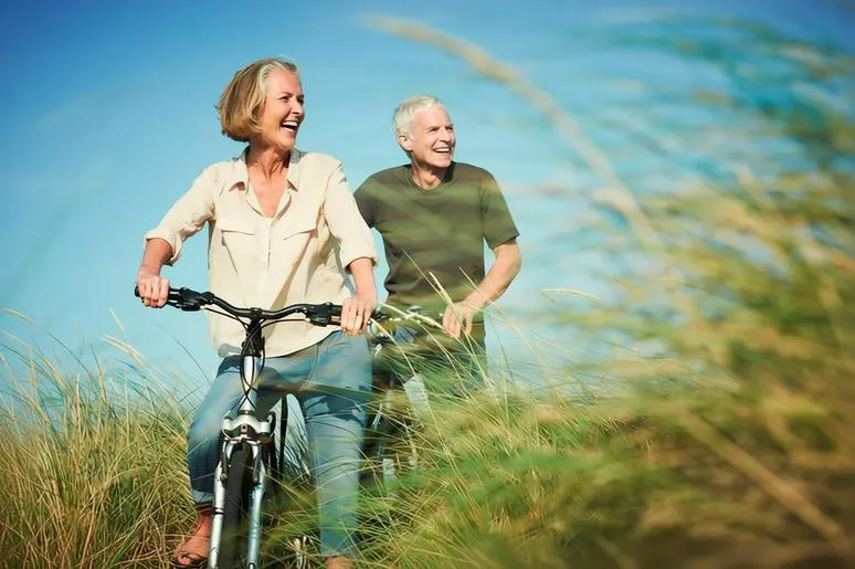 Professional caregiver supporting an older adult at home